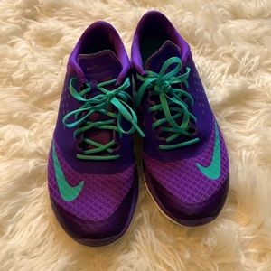 Purple and green Nike shoes size 7.5